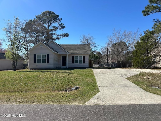 single story home featuring a front yard and concrete driveway