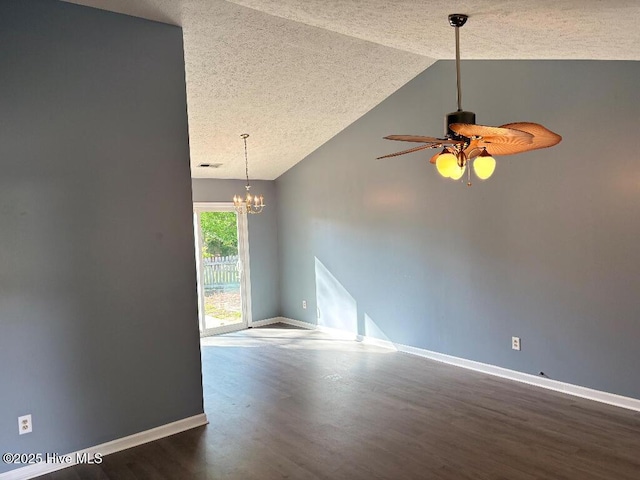 spare room with dark wood-style flooring, a textured ceiling, lofted ceiling, baseboards, and a ceiling fan