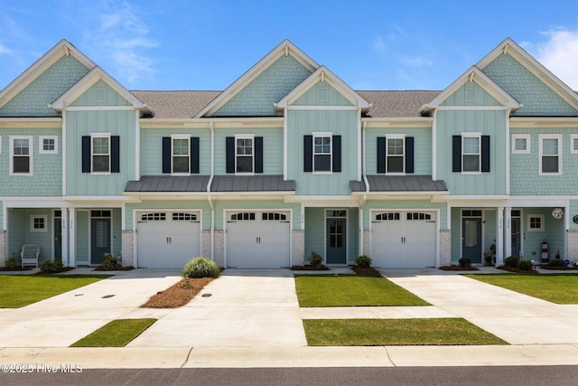 254 Great Egret Way, Beaufort, NC 28516 - townhome / multi-family property with board and batten siding, an attached garage, and driveway