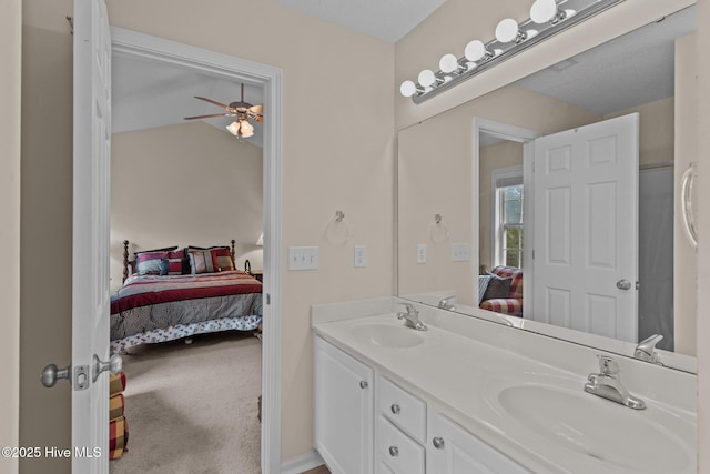 4979 Montserrat Dr, Southport, NC 28461 - ensuite bathroom featuring double vanity and a ceiling fan