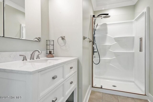 1324 S Shore Dr, Southport, NC 28461 - full bathroom with a shower stall, vanity, baseboards, and tile patterned flooring