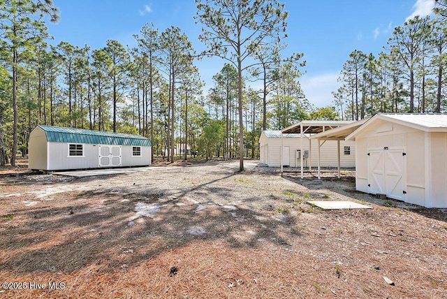 1324 S Shore Dr, Southport, NC 28461 - view of yard featuring a shed and an outdoor structure