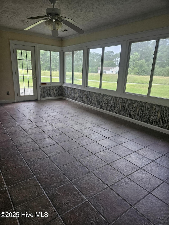 4 Cleek Ct, Carolina Shores, NC 28467 - unfurnished sunroom with baseboards, crown molding, and a textured ceiling
