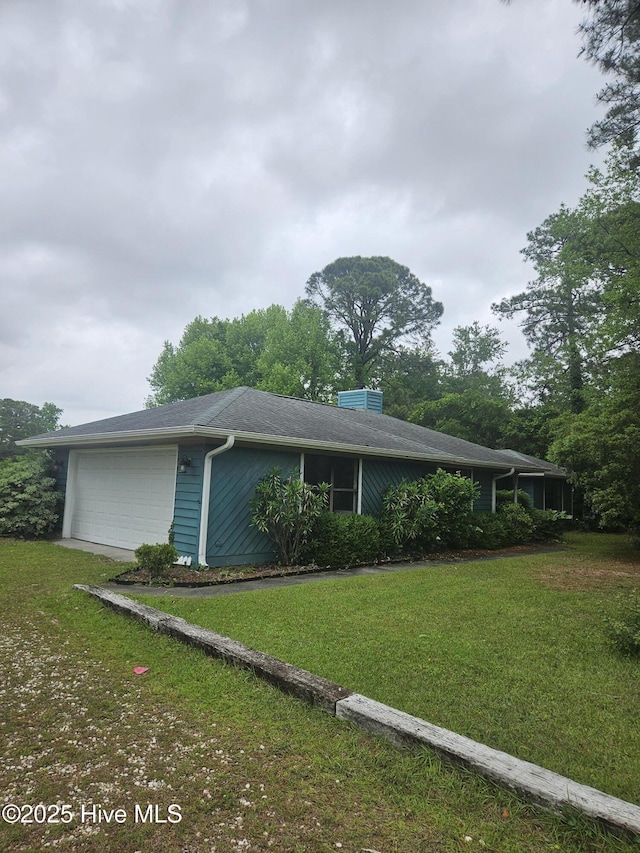 4 Cleek Ct, Carolina Shores, NC 28467 - view of front of home featuring a front lawn and an attached garage