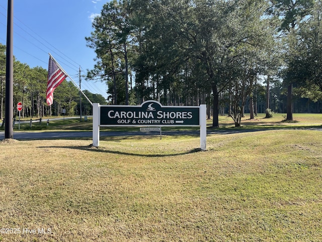 4 Cleek Ct, Carolina Shores, NC 28467 - community sign featuring a lawn