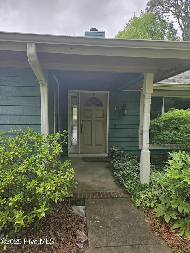 4 Cleek Ct, Carolina Shores, NC 28467 - view of exterior entry featuring covered porch