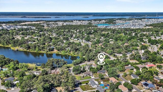 aerial overview of property's location featuring a large body of water and nearby suburban area