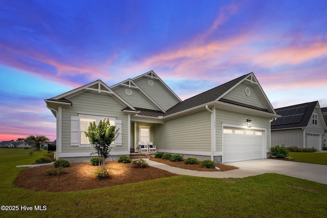 357 Spicer Lake Dr, Holly Ridge, NC 28445 - view of front of property featuring a lawn, concrete driveway, and a garage