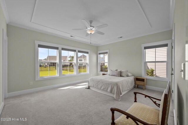 357 Spicer Lake Dr, Holly Ridge, NC 28445 - bedroom featuring carpet, multiple windows, baseboards, ornamental molding, and ceiling fan