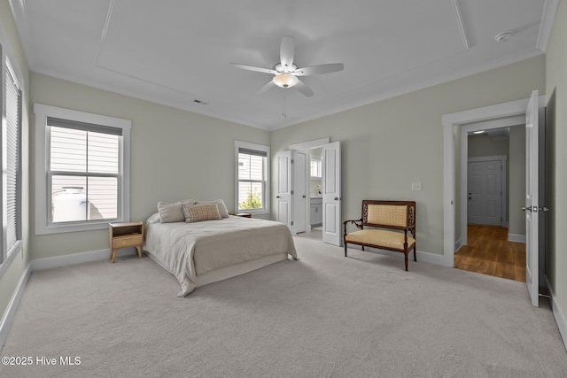 357 Spicer Lake Dr, Holly Ridge, NC 28445 - carpeted bedroom with baseboards, ceiling fan, and ensuite bath