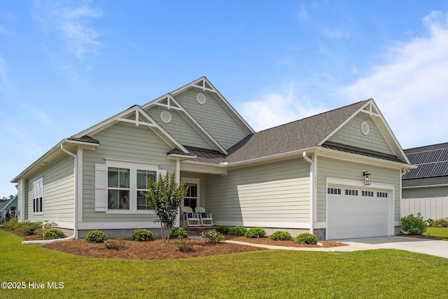 357 Spicer Lake Dr, Holly Ridge, NC 28445 - craftsman-style house with a standing seam roof, a garage, a front lawn, and driveway