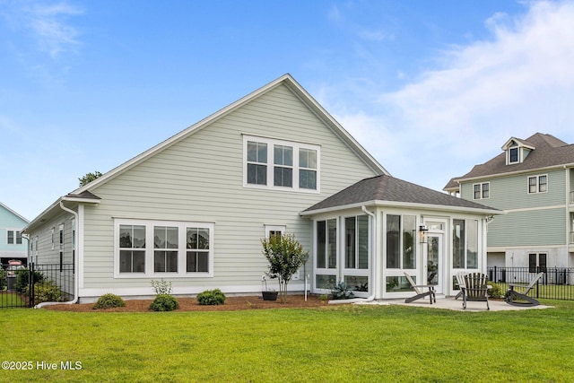 357 Spicer Lake Dr, Holly Ridge, NC 28445 - rear view of house with a sunroom and a patio area