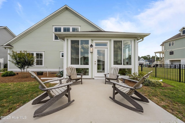 357 Spicer Lake Dr, Holly Ridge, NC 28445 - back of house featuring a sunroom and a patio area
