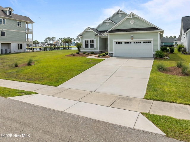 357 Spicer Lake Dr, Holly Ridge, NC 28445 - craftsman house with a garage, a front yard, and concrete driveway