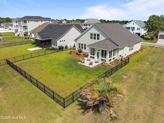 357 Spicer Lake Dr, Holly Ridge, NC 28445 - rear view of house featuring a patio area, a sunroom, roof with shingles, and a residential view