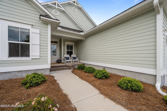 357 Spicer Lake Dr, Holly Ridge, NC 28445 - doorway to property featuring a porch