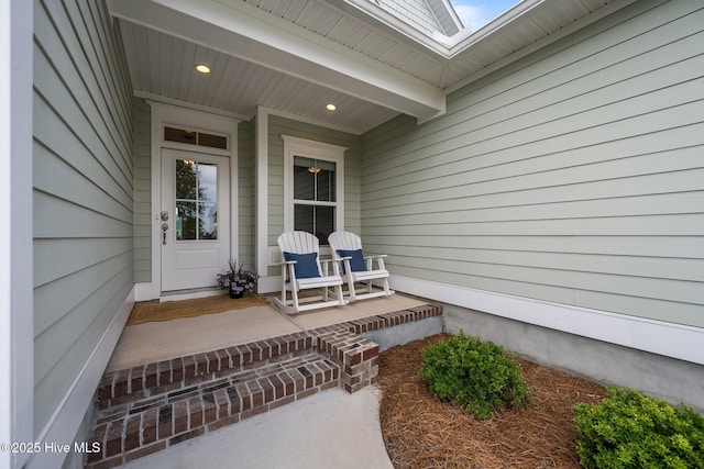 357 Spicer Lake Dr, Holly Ridge, NC 28445 - view of exterior entry with a porch