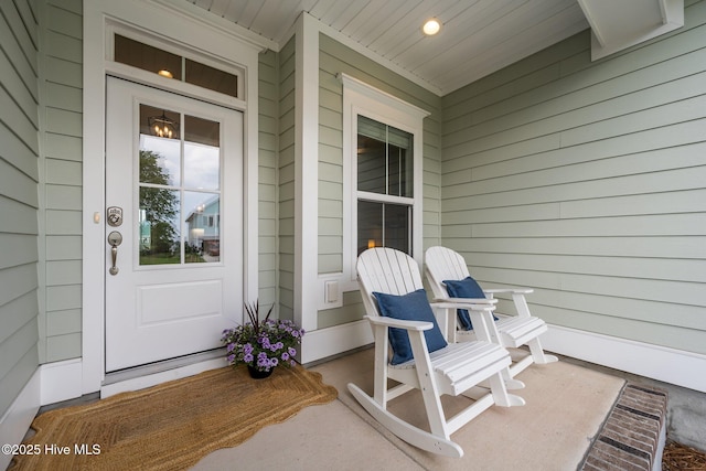 357 Spicer Lake Dr, Holly Ridge, NC 28445 - view of exterior entry featuring covered porch