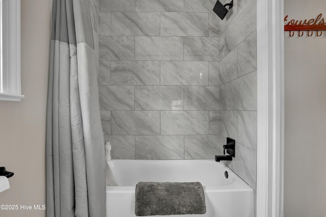 bathroom with shower / bath combo