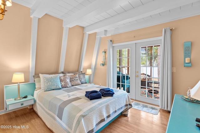 159 NE 31st St, Oak Island, NC 28465 - bedroom with access to outside, french doors, beam ceiling, wood finished floors, and wood ceiling