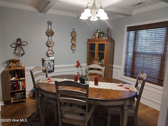dining area with a chandelier, wood finished floors, crown molding, beam ceiling, and coffered ceiling