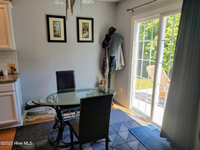 dining space featuring baseboards
