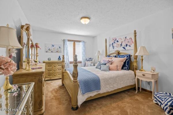 bedroom with light carpet and a textured ceiling