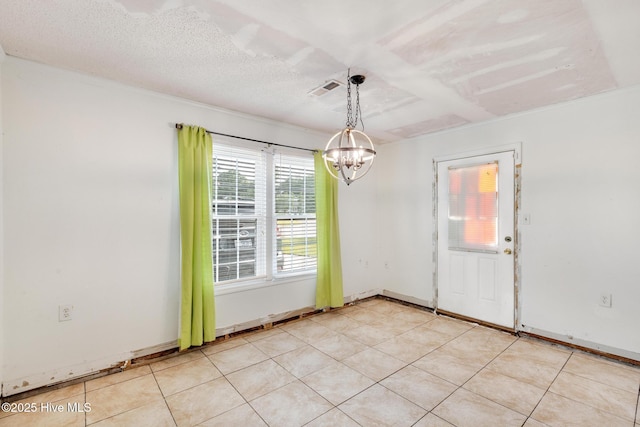 304 Pebble Ln, Jacksonville, NC 28546 - empty room with a chandelier and light tile patterned flooring