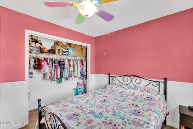 304 Pebble Ln, Jacksonville, NC 28546 - bedroom featuring wood finished floors, a closet, ceiling fan, and baseboards
