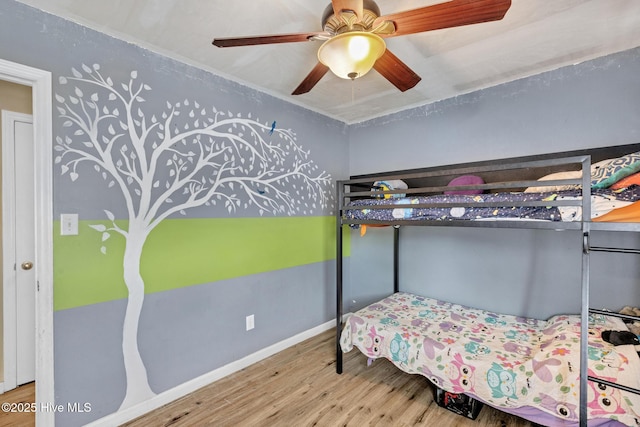 304 Pebble Ln, Jacksonville, NC 28546 - bedroom featuring wood finished floors, a ceiling fan, and baseboards