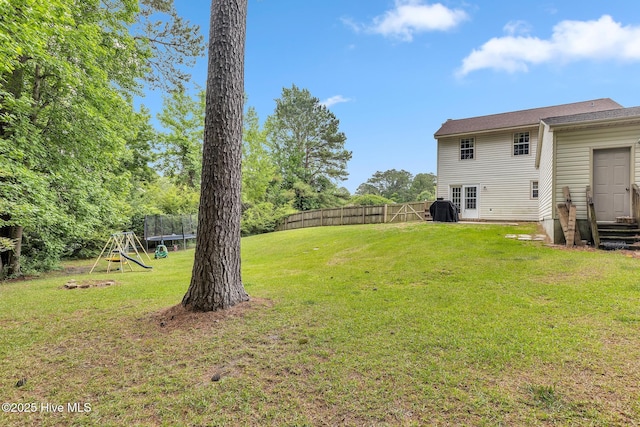 304 Pebble Ln, Jacksonville, NC 28546 - view of yard featuring a playground and a trampoline