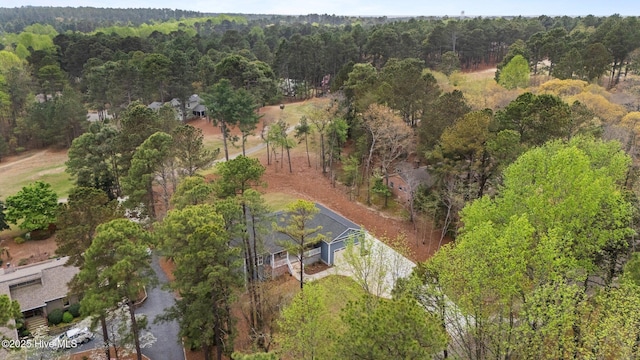 aerial view of property's location with a forest