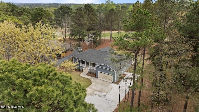 view from above of property featuring a forest