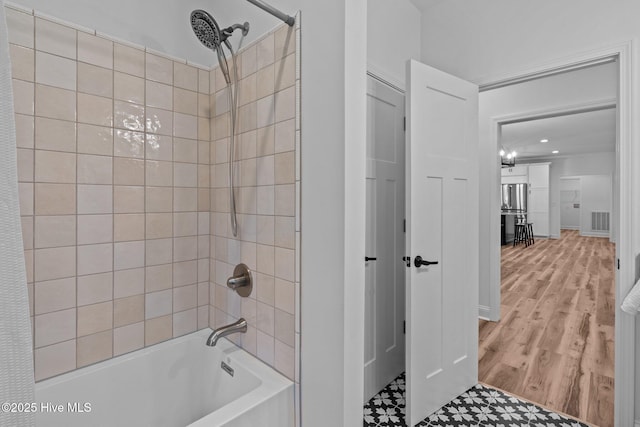 full bathroom featuring shower / washtub combination and recessed lighting