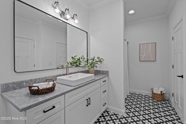 full bath featuring tile patterned floors, vanity, baseboards, and ornamental molding