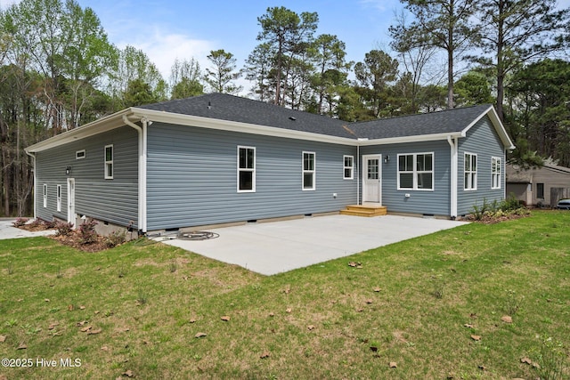 back of property featuring crawl space, a patio area, and a lawn