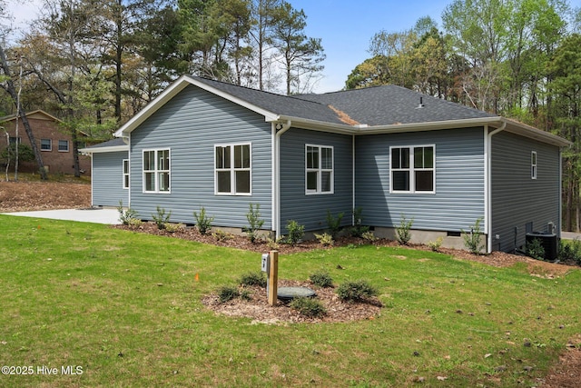 view of property exterior with a lawn, crawl space, cooling unit, and a patio