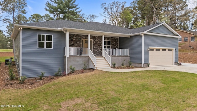 ranch-style house with a porch, an attached garage, driveway, and a front lawn