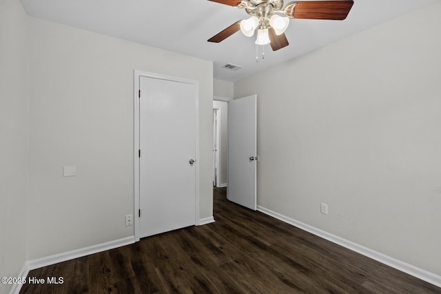 208 E Lakeridge Lndg, Jacksonville, NC 28546 - unfurnished bedroom with wood finished floors, baseboards, and a ceiling fan