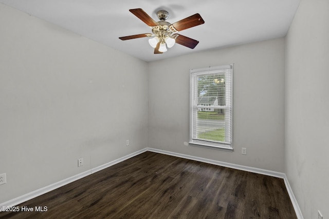208 E Lakeridge Lndg, Jacksonville, NC 28546 - empty room with dark wood-style flooring, baseboards, and a ceiling fan
