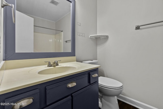 208 E Lakeridge Lndg, Jacksonville, NC 28546 - full bathroom featuring crown molding, toilet, vanity, wood finished floors, and baseboards
