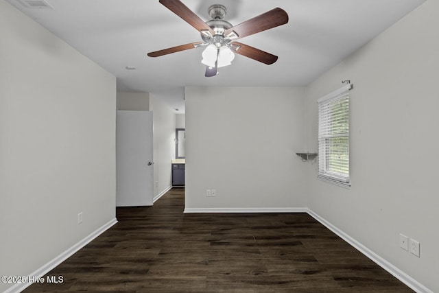 208 E Lakeridge Lndg, Jacksonville, NC 28546 - empty room with baseboards, dark wood-style floors, and a ceiling fan
