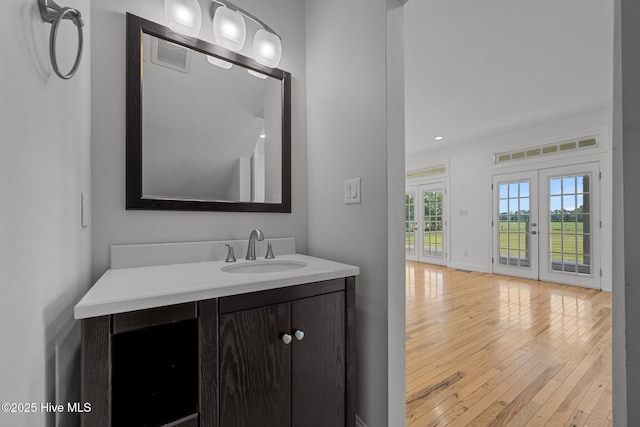 2142 Raccoon Rd, Willard, NC 28478 - bathroom with hardwood / wood-style floors, vanity, and recessed lighting