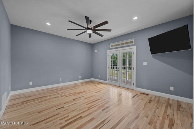 2142 Raccoon Rd, Willard, NC 28478 - empty room with a ceiling fan, light wood-style flooring, french doors, baseboards, and recessed lighting