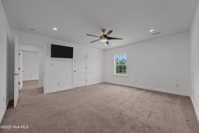 2142 Raccoon Rd, Willard, NC 28478 - unfurnished bedroom featuring light carpet, baseboards, recessed lighting, and a ceiling fan