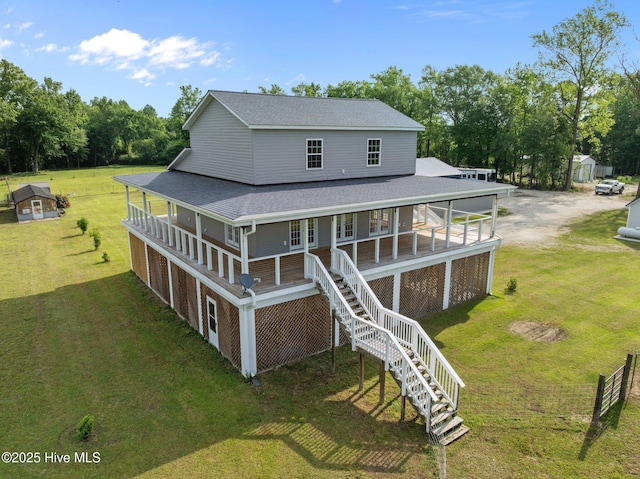 2142 Raccoon Rd, Willard, NC 28478 - rear view of property with covered porch, a lawn, roof with shingles, and stairway