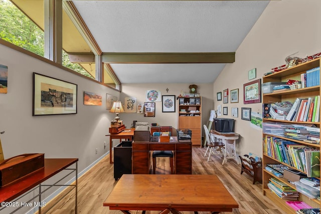 office space with wood finished floors, a textured ceiling, and baseboards