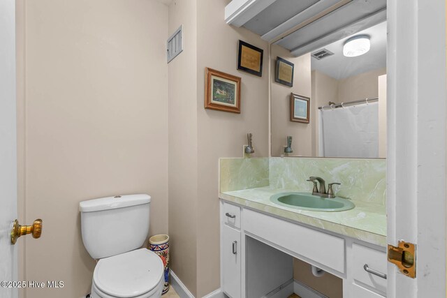 full bath with vanity and toilet