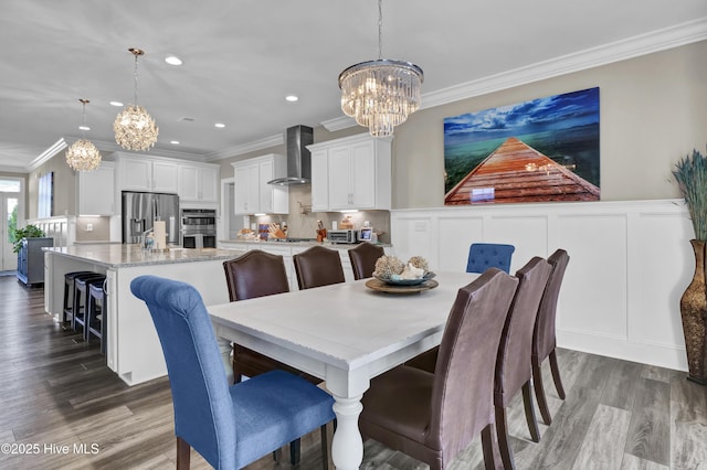 dining space with a chandelier, ornamental molding, recessed lighting, and dark wood-type flooring