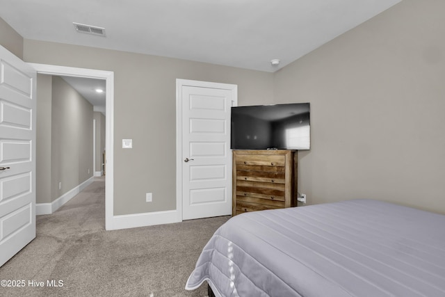 carpeted bedroom featuring baseboards